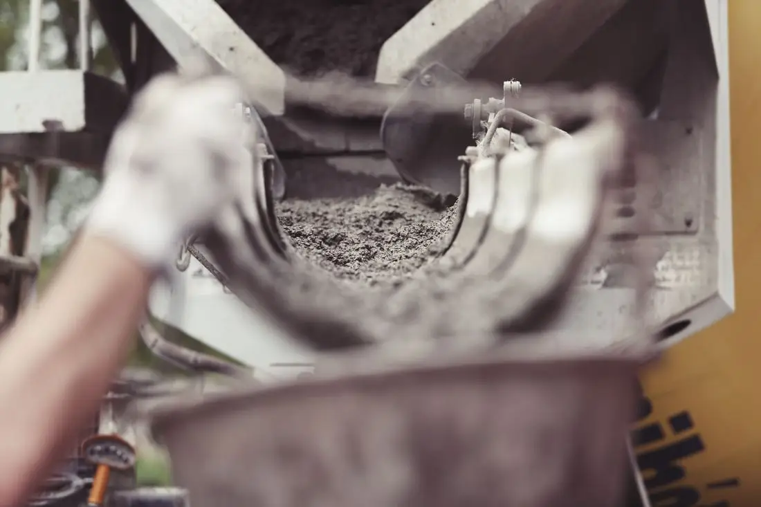 Concrete coming down the chute of a mixer truck, close up