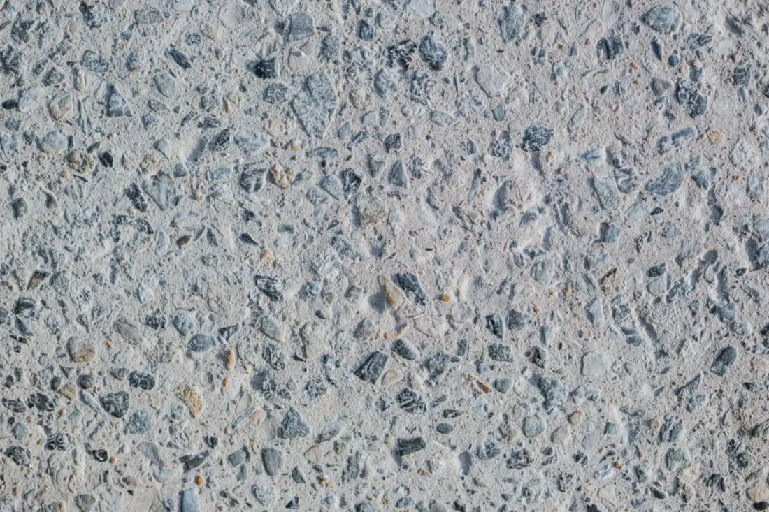 Close-up of concrete with small stones showing through the surface