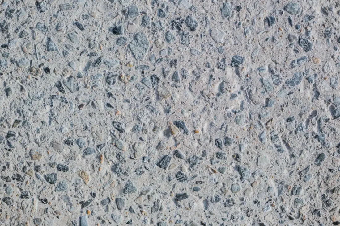Close-up of concrete with small stones showing through the surface